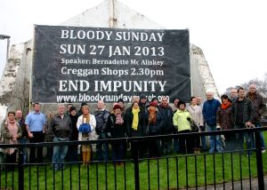 Photograph of the launch of the Announcement-Mural on the back of Free Derry Corner wall.